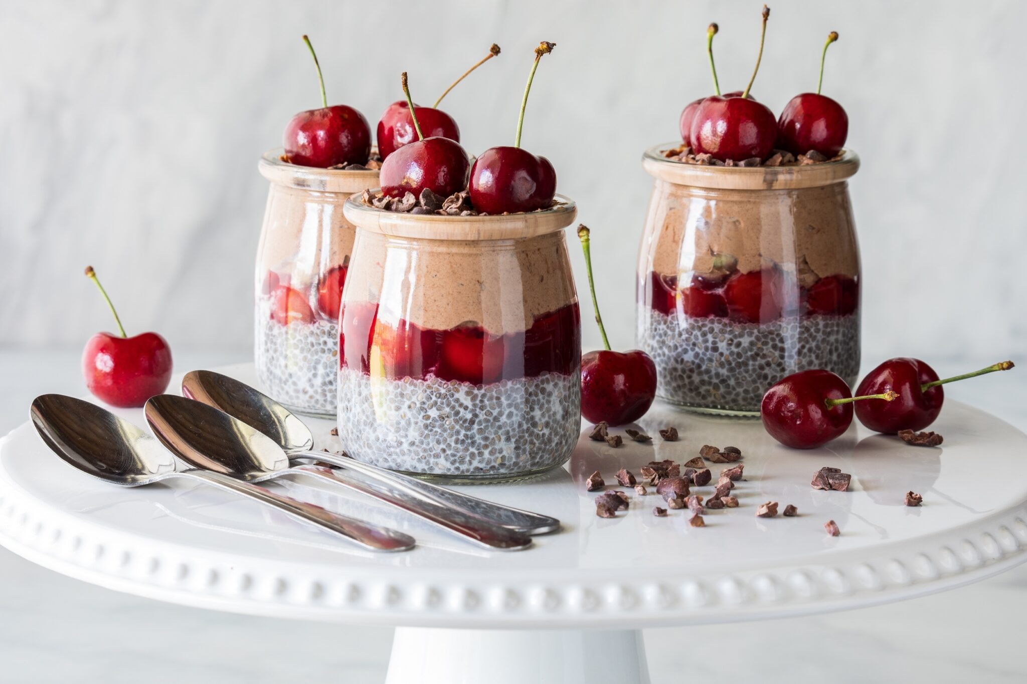 Black,Forest,Chia,Puddings,Topped,With,Fresh,Cherries,On,A