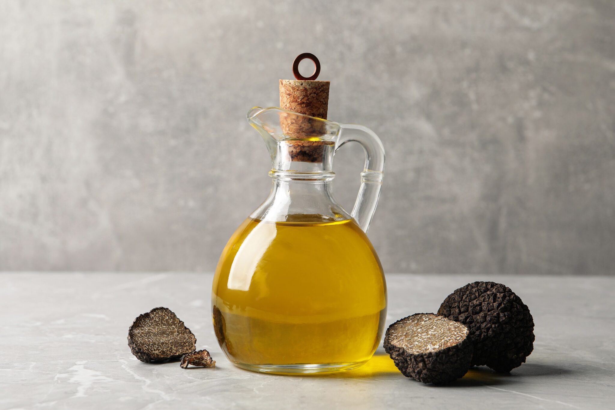 Fresh,Truffles,And,Oil,On,Light,Grey,Marble,Table