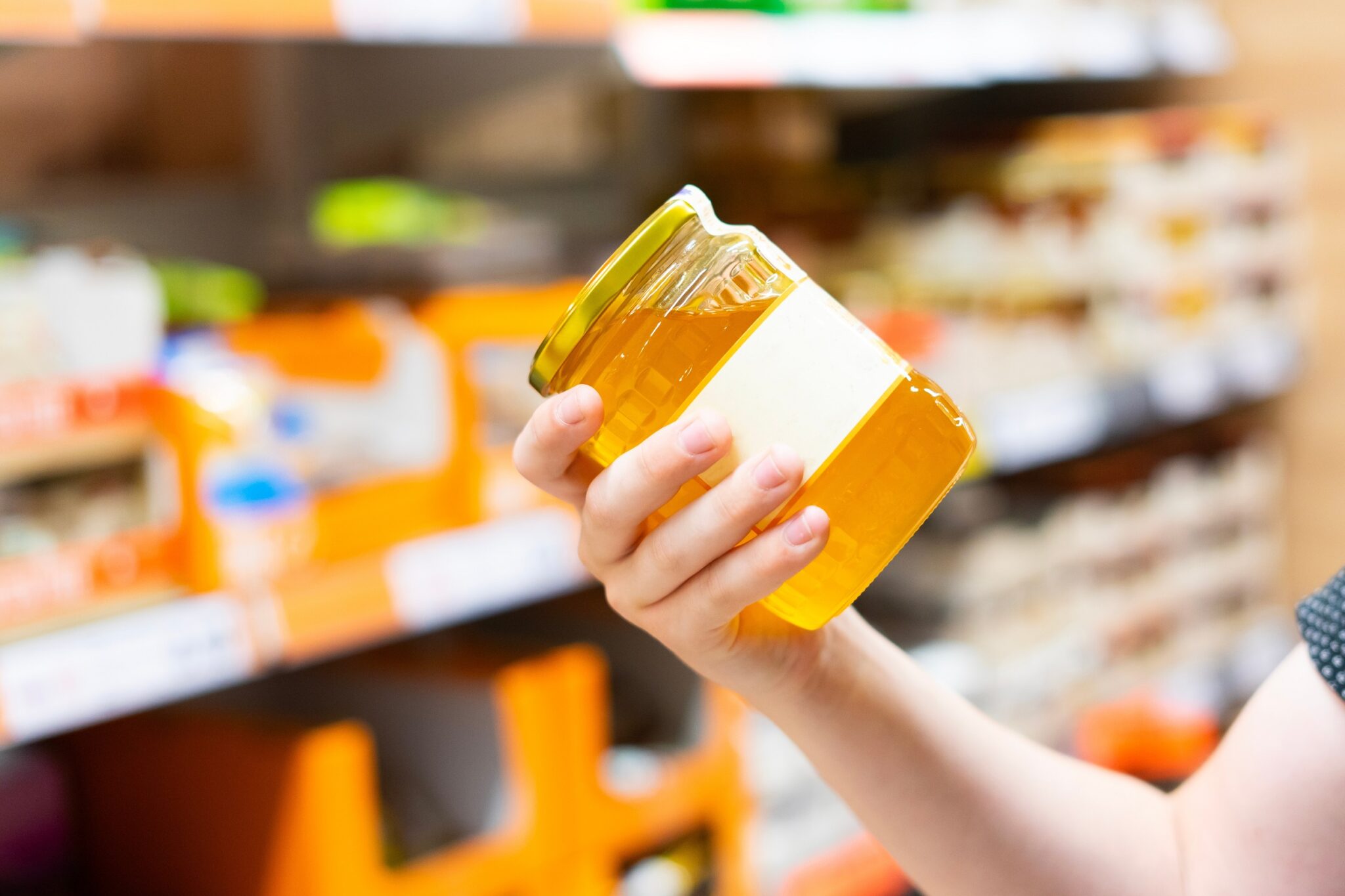 The,Guy,In,The,Supermarket,Holds,A,Glass,Jar,Of