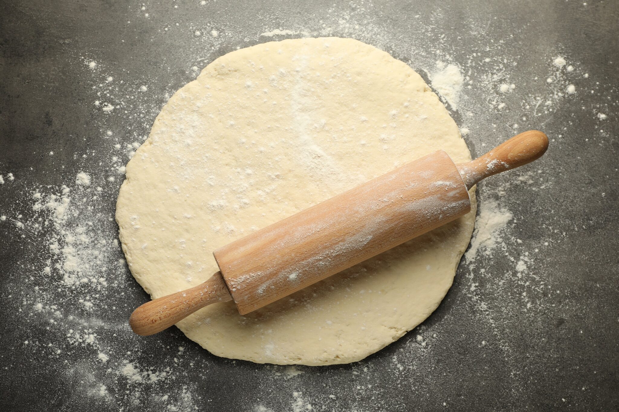 Fresh,Dough,And,Rolling,Pin,On,Grey,Table,,Top,View