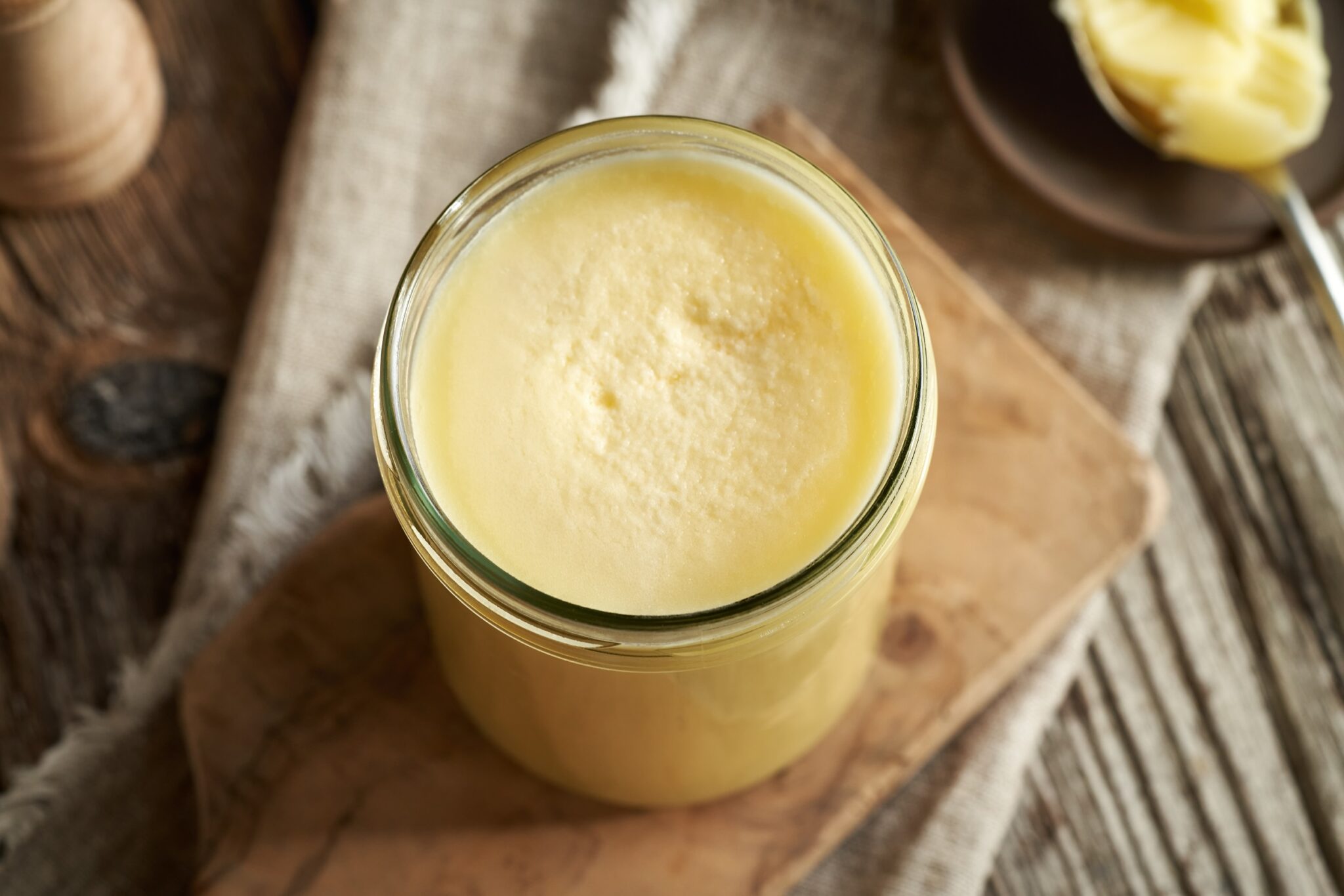 Ghee,Or,Clarified,Butter,In,A,Glass,Jar