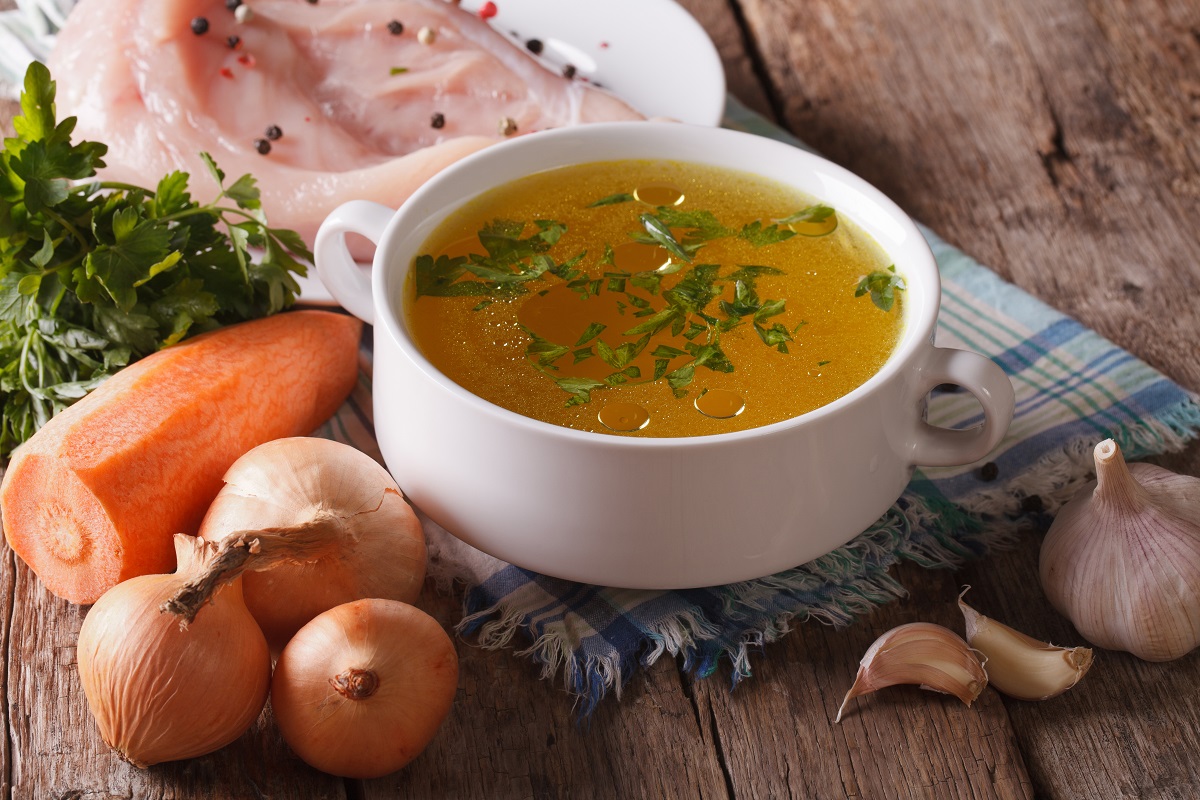 Chicken,Broth,And,Ingredients,On,The,Table,Close-up.,Horizontal,,Rustic