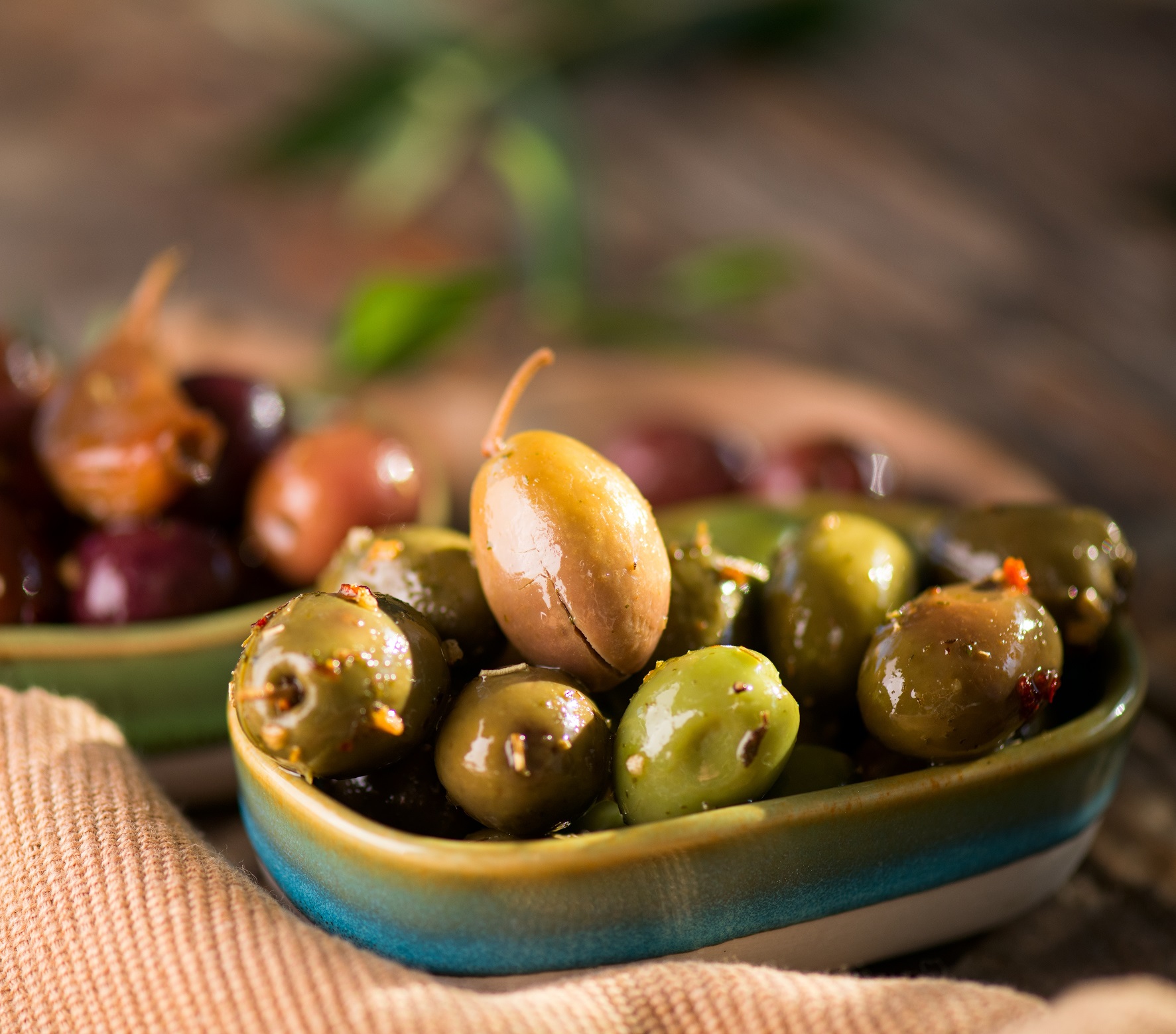 Olives,,Homemade,Marinated,Colorful,Olives,With,Herbs,And,Spices,On
