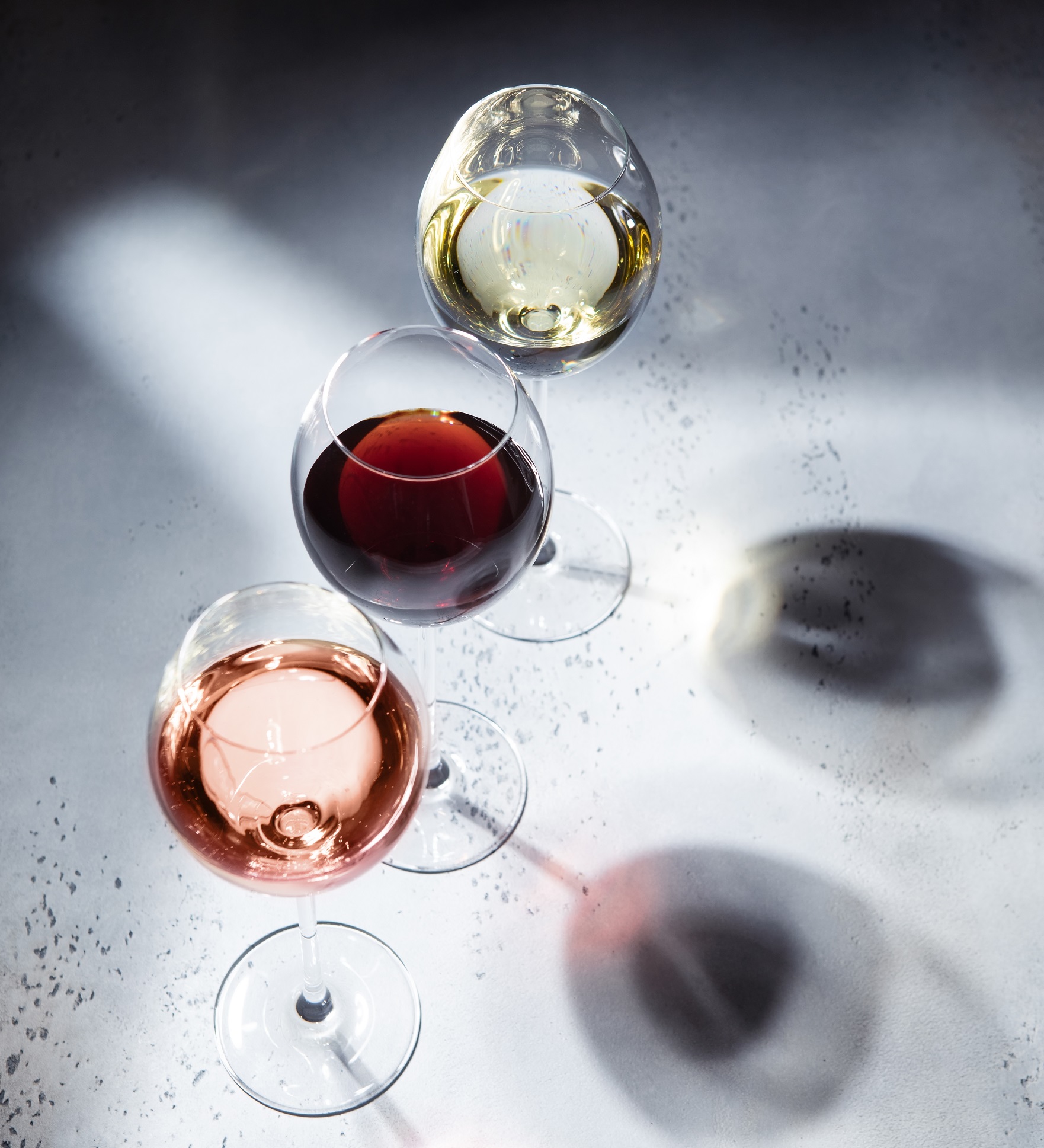 Pink,Rose,red,And,White,Wine,Glasses,On,Light,Background,With