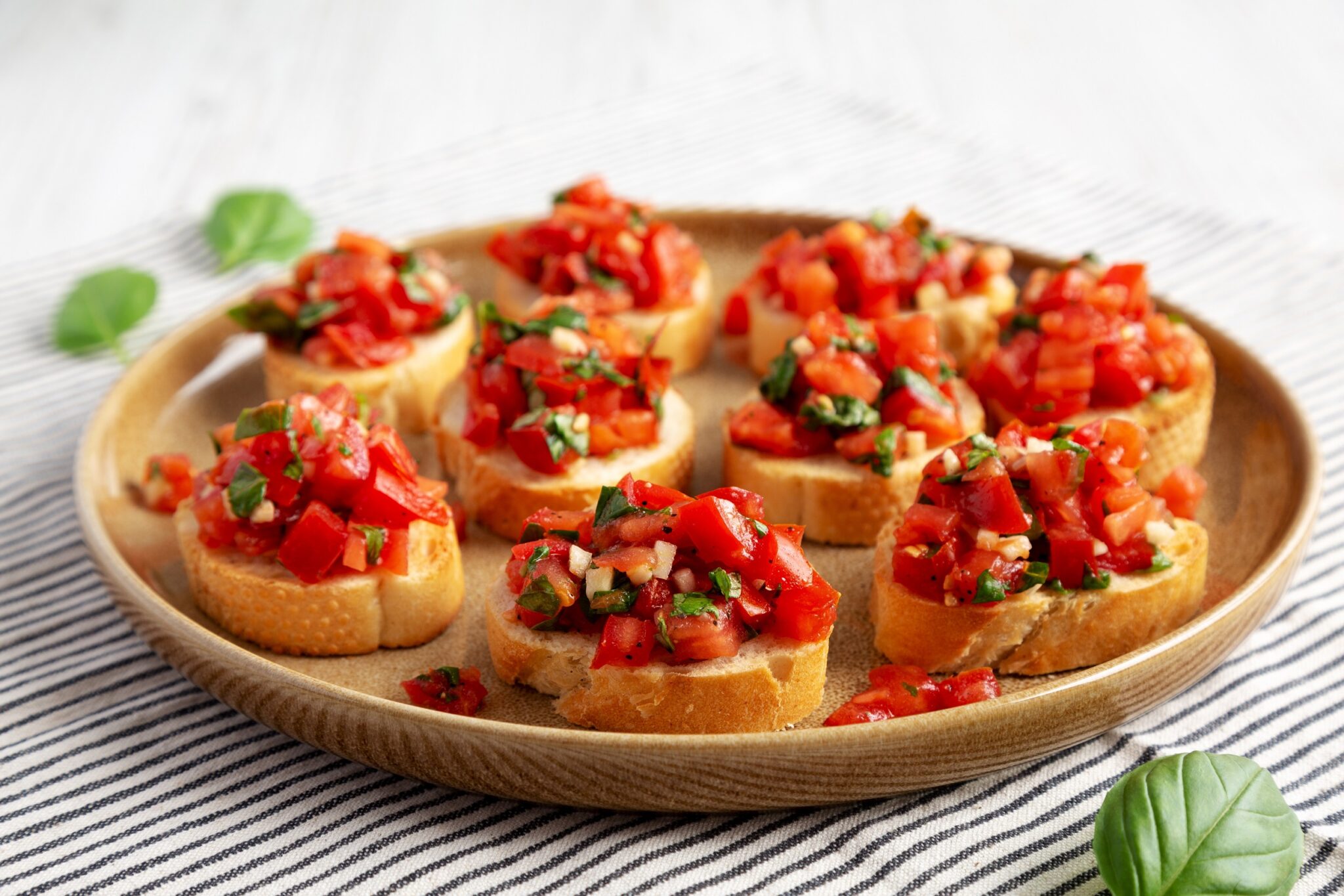 Homemade,Italian,Tomato,Bruschetta,On,A,Plate,,Side,View.