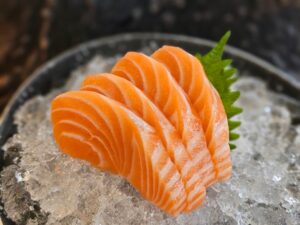 Enjoy,The,Exquisite,Presentation,Of,Fresh,Salmon,Sashimi,Delicately,Placed