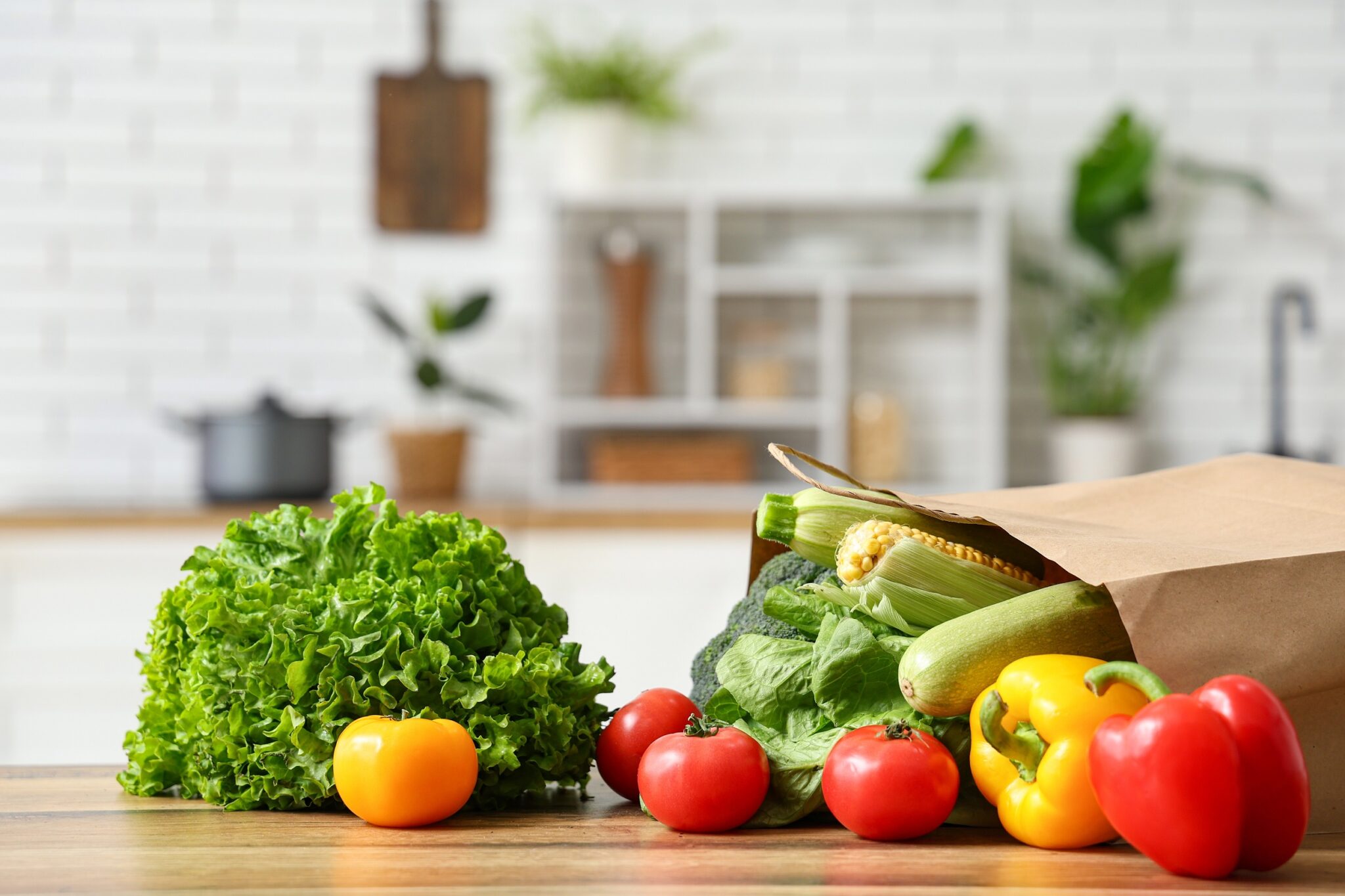 Shopping,Bag,With,Different,Fresh,Vegetables,On,Wooden,Kitchen,Counter