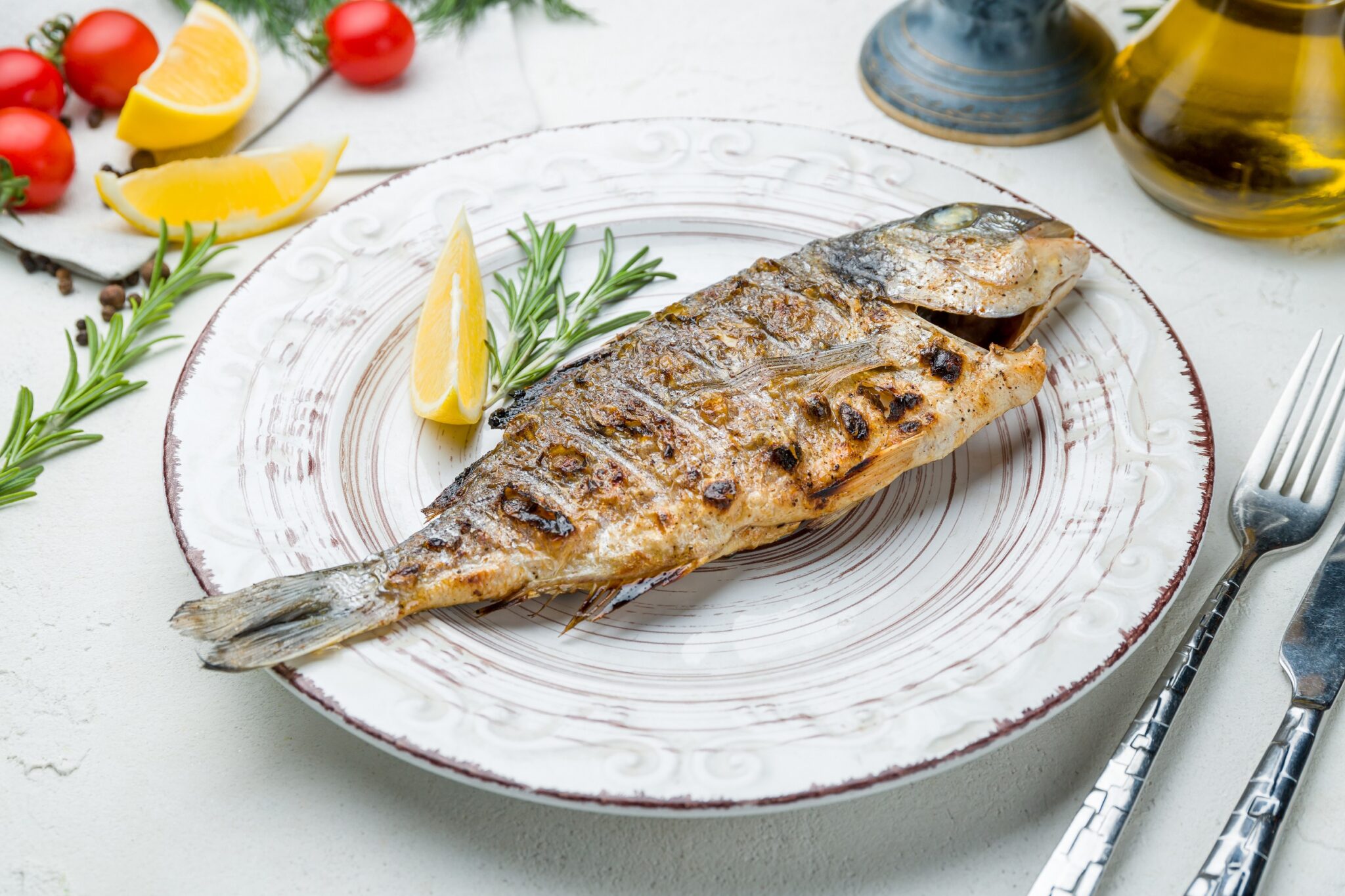 Dorado,On,Grill,On,A,Beautiful,Plate,On,White,Concrete