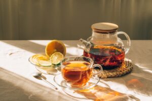 Glass,Teapot,With,Brewed,Tea,,Cup,Of,Tea,And,Lime