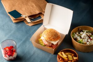 Burger,In,Ecofriendly,Box,With,Salad,And,French,Fries,On