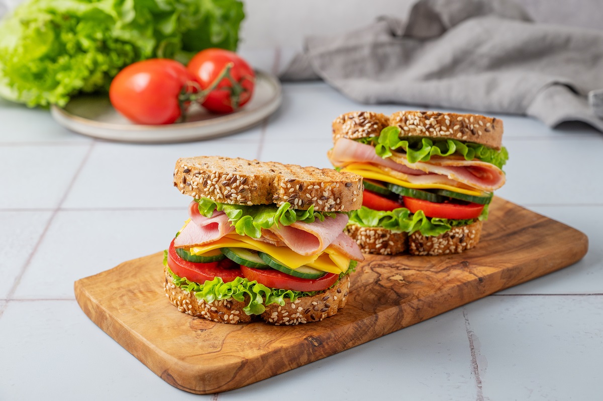 Two,Sandwich,Or,Toasts,With,Ham,,Cheese,,Lettuce,And,Vegetables