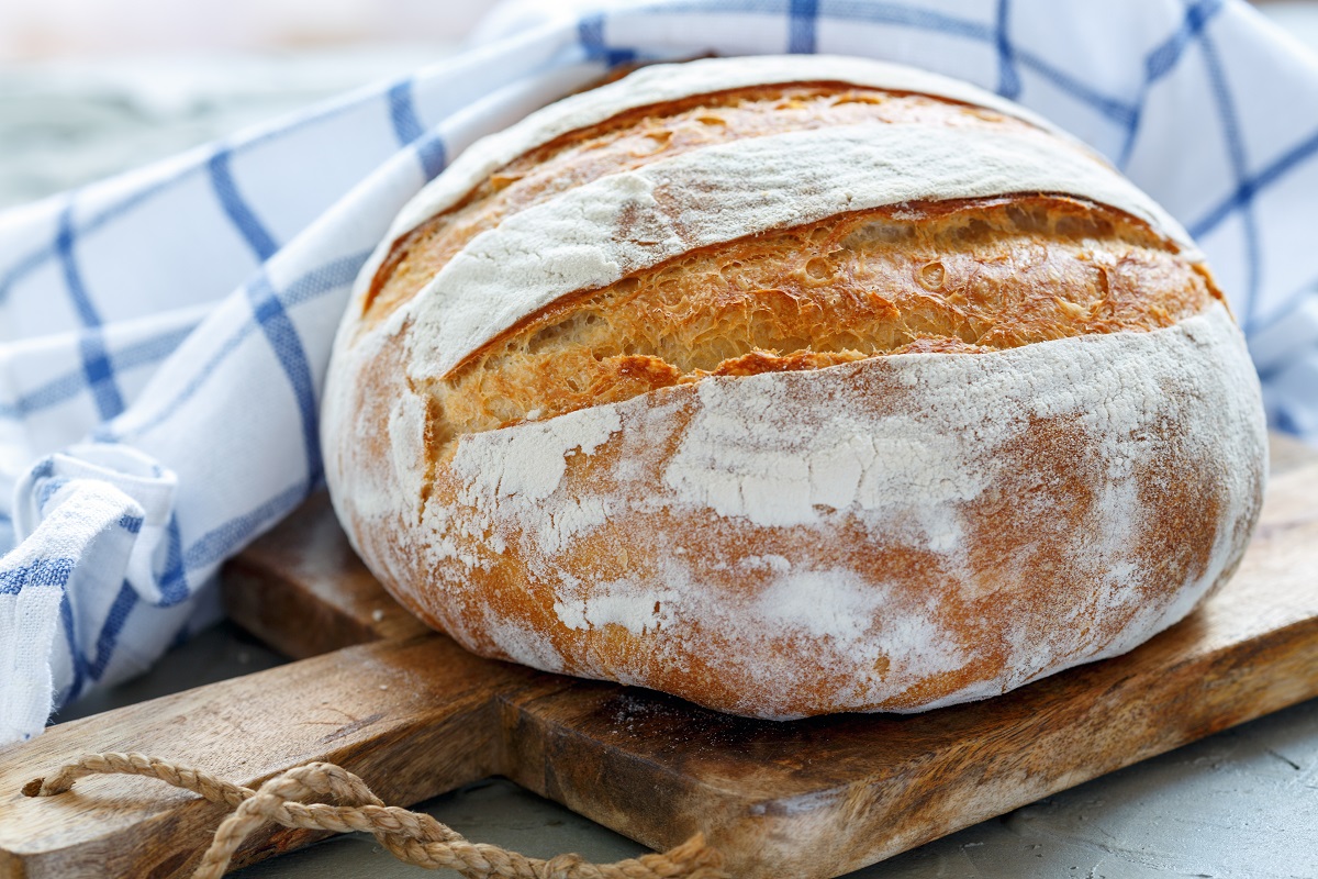 Homemade,Wheat,Bread,On,Wooden,Board,And,Linen,Napkin.