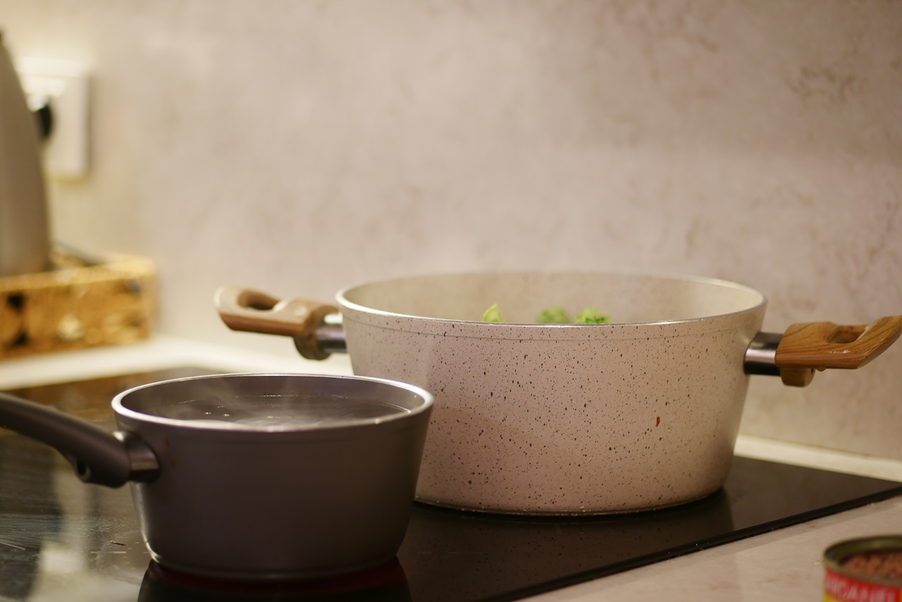 Cooking,Vegetables,In,A,Modern,Kitchen,Setting,With,Pots,And