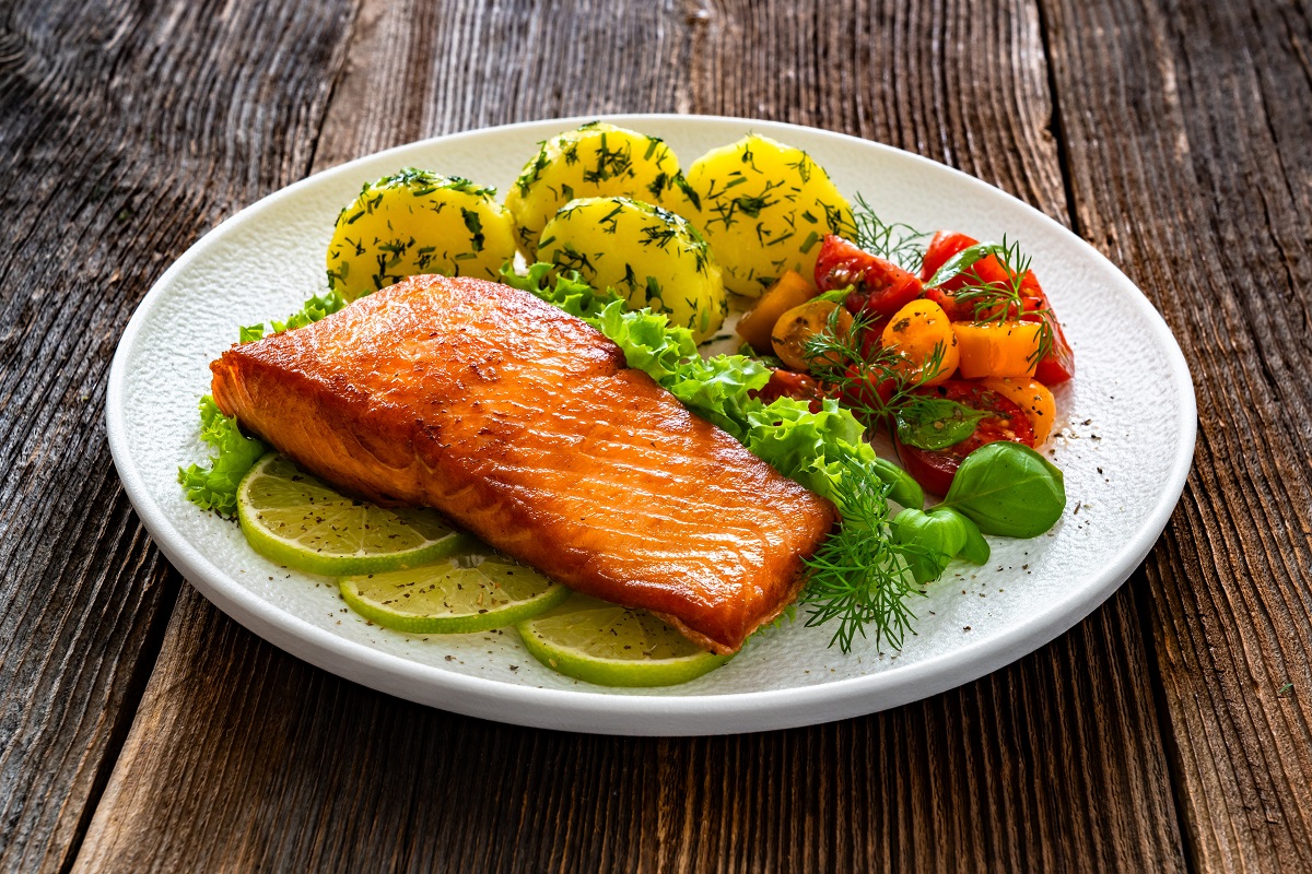 Seared,Salmon,Steak,With,Cherry,Tomato,Salad,And,Boiled,Potatoes
