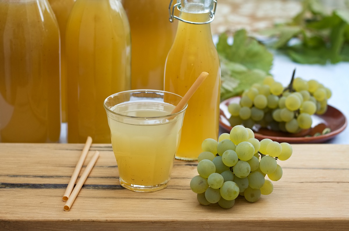 Homemade,White,Grape,Syrup,In,Bottles,And,Grape,Juice,In