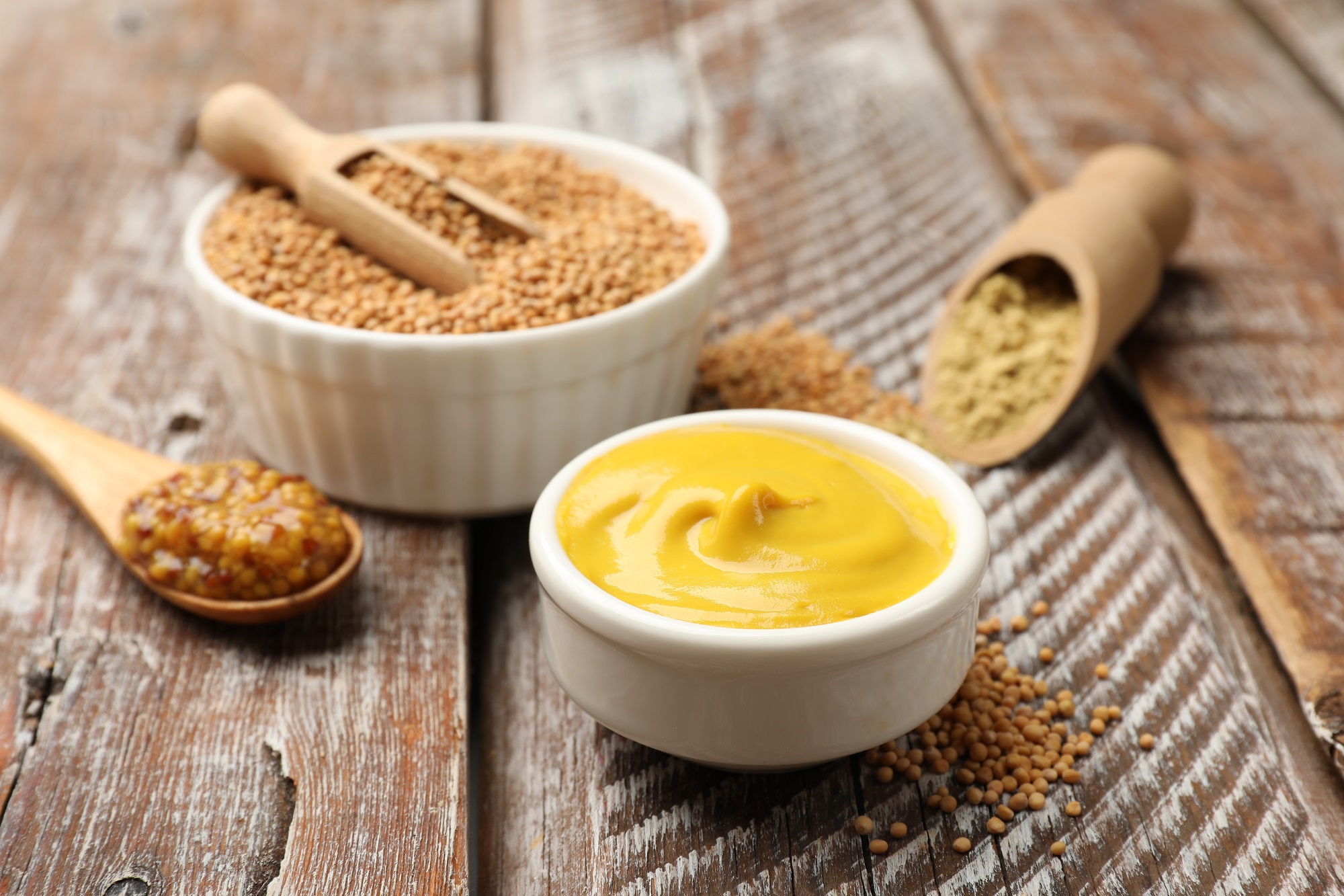 Different,Types,Of,Mustard,On,Wooden,Table,,Closeup