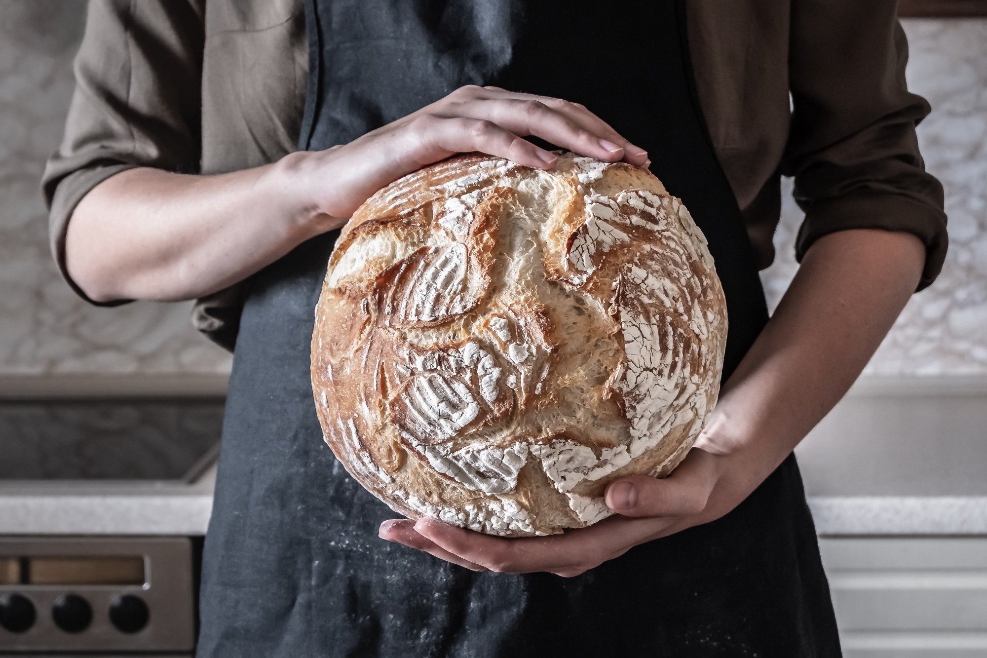 Close-up,Image,Of,Female,Hands,Holding,Big,Loaf,Of,White
