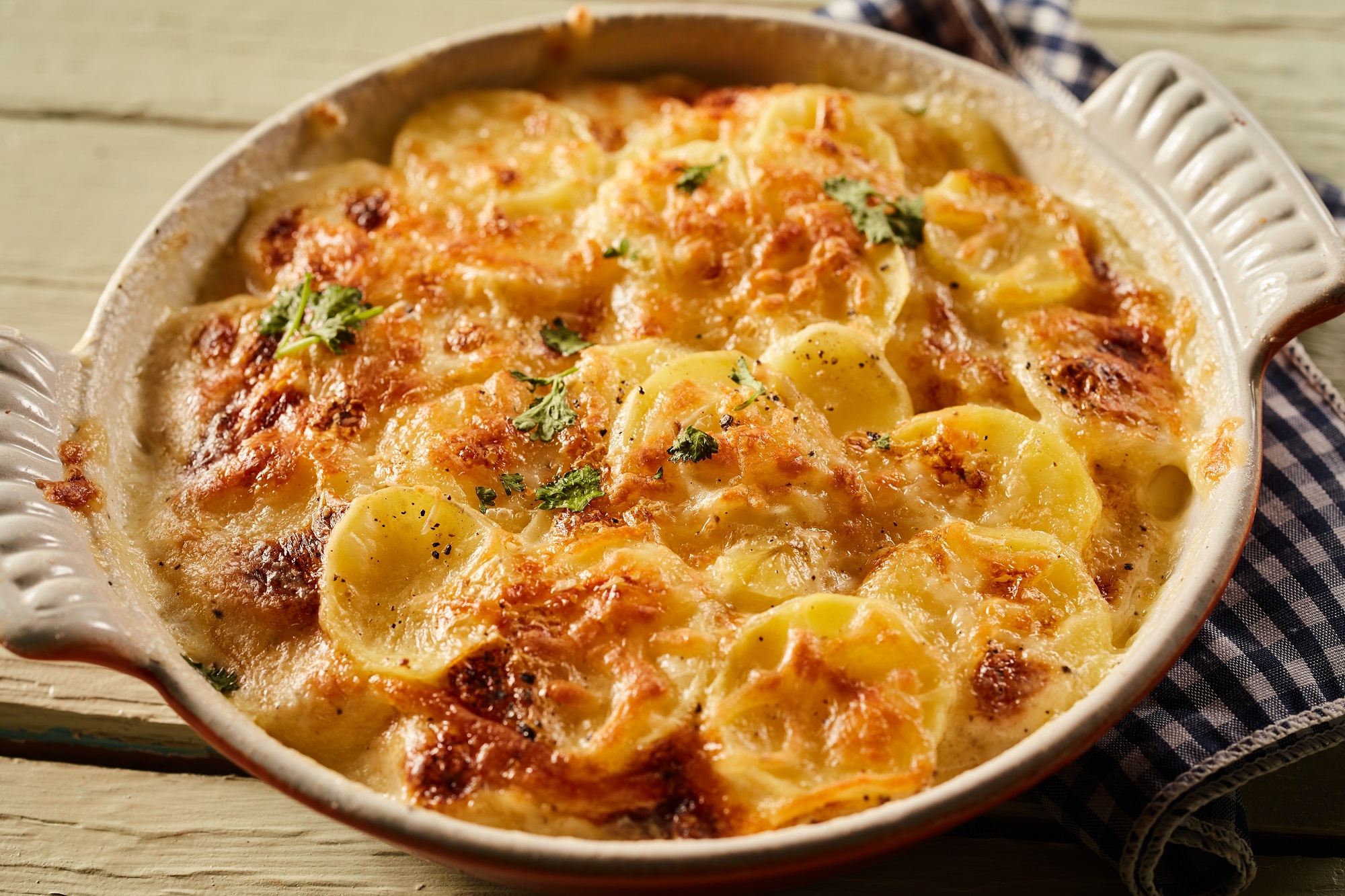 High,Angle,Of,Homemade,Potato,Gratin,With,Crust,Made,Of