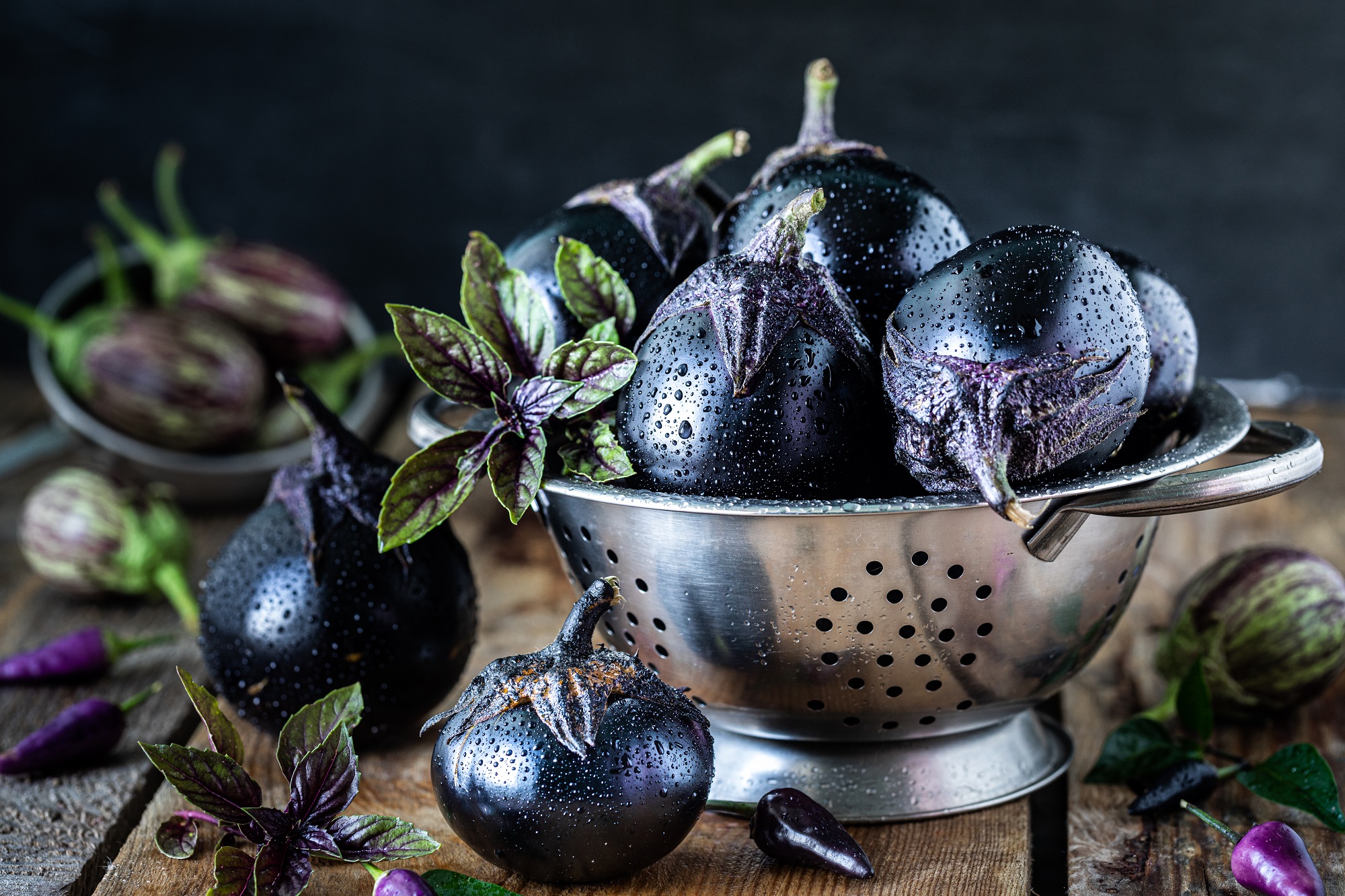 Eggplants,Of,Different,Colors,And,Different,Grades,On,A,Wooden
