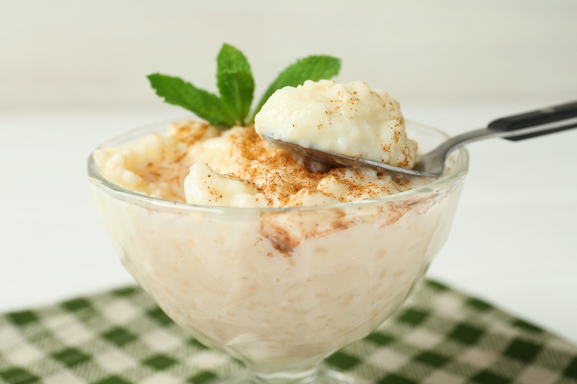 Taking,Delicious,Rice,Pudding,At,Table,,Closeup